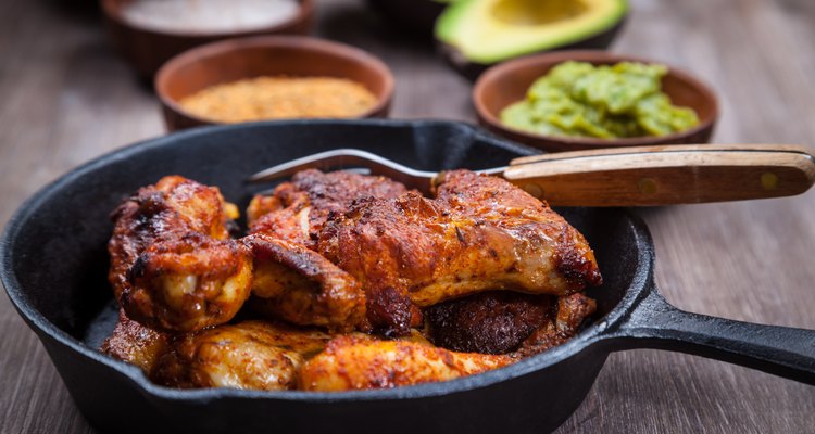 Grilled chicken legs and wings with guacamole