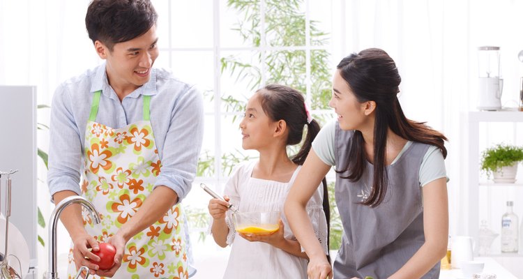 Family cooking in kitchen