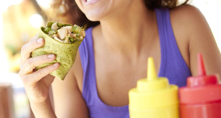 Woman Holding Chicken Wrap