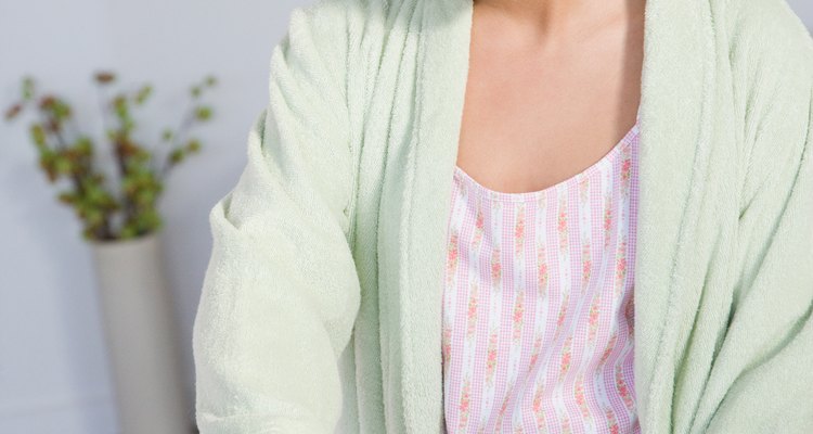 Use an iron and waxed paper to refresh a T-shirt decal.