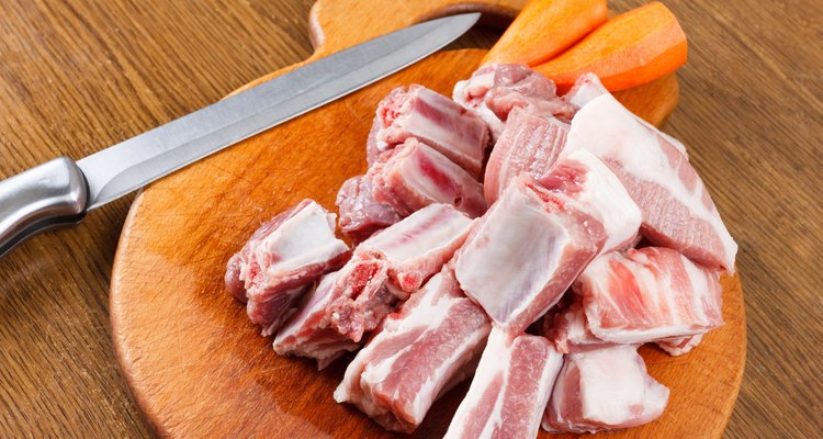 Raw pork ribs on a cutting board