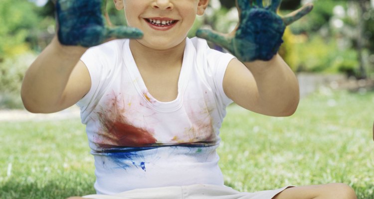 Portrait of a boy painted hands