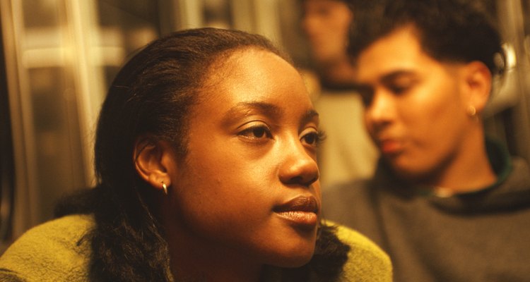 Teenage girl (16-17) on train, close-up