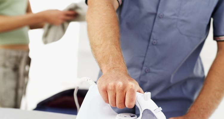 Man ironing a shirt