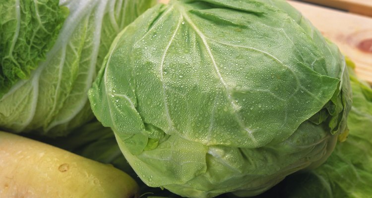 Closed Up Image of a Cabbage With Water drops On it, Surrounded By Other Vegetables, High Angle View