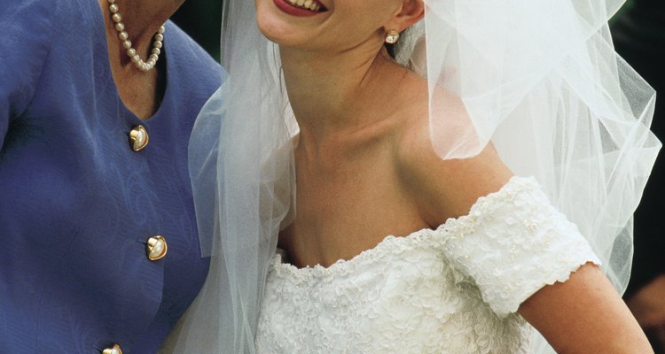 The mother-of-the-bride is not obligated to match the bridesmaids. She should look like the distinguished woman she is.