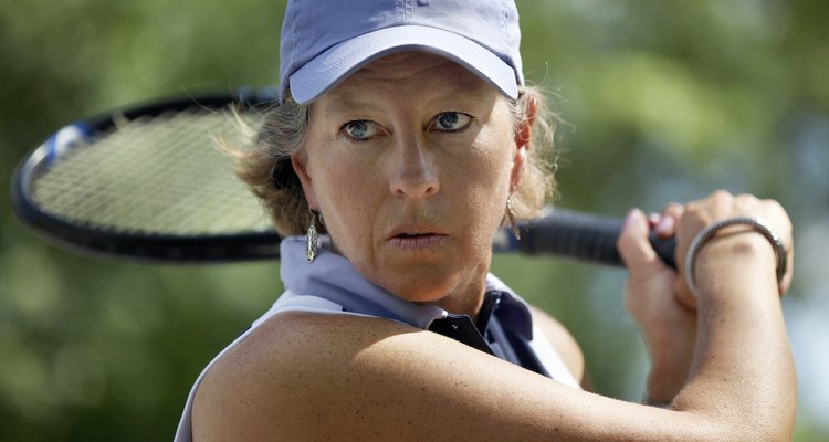 Close-up of a mature woman playing tennis