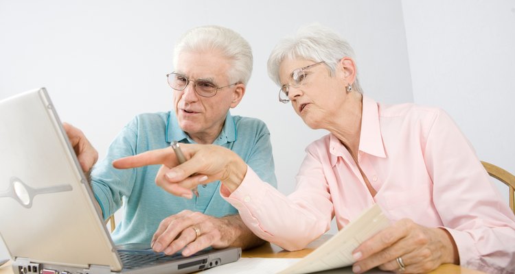 Couple at table with laptop computer