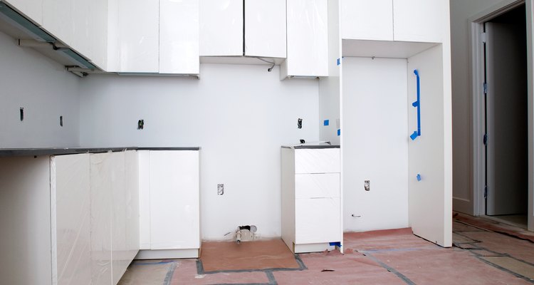 Glue Formica to plywood to make waterproof surfaces.
