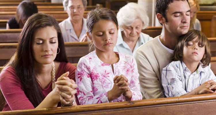 Family praying in church