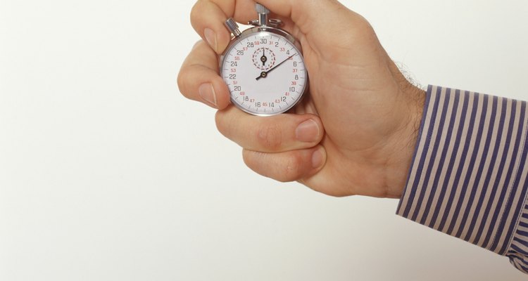 Man holding stopwatch, Close-up of hand