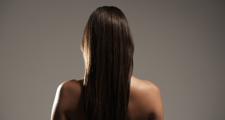 Young woman with long hair, rear view