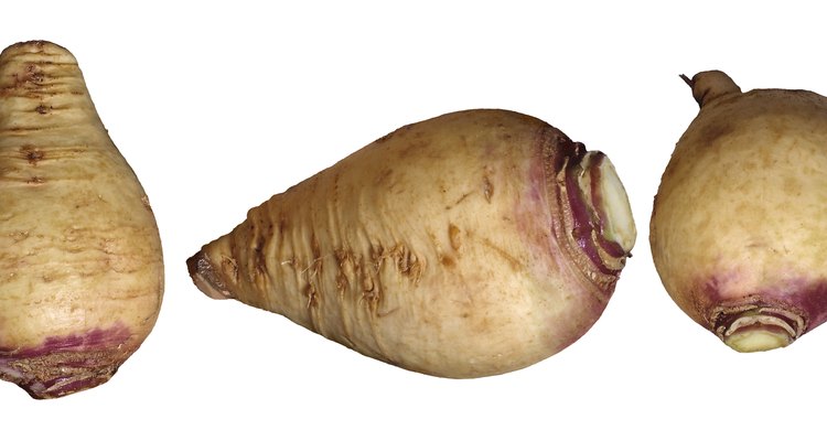 Enjoy the subtle flavour of swede by lightly seasoning it with garlic and other herbs prior to roasting.