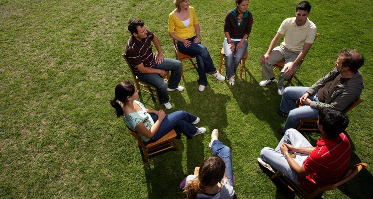 Group of people sitting on chairs in park, elevated view