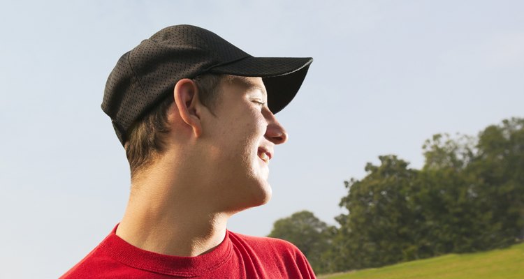 Teenage boy wearing baseball cap