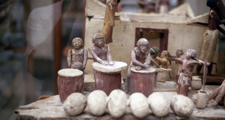 This ancient Egyptian tomb offering of a model bakery shows the square building style.