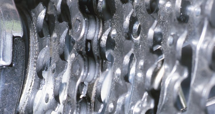 The front dérailleur is metal cage that pushes the chain from one sprocket to the next.