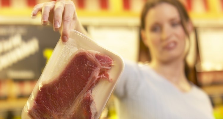 Woman holding a steak