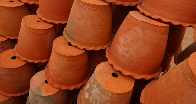 Clay pots have a hole in the bottom, perfect for inserting a solar light.