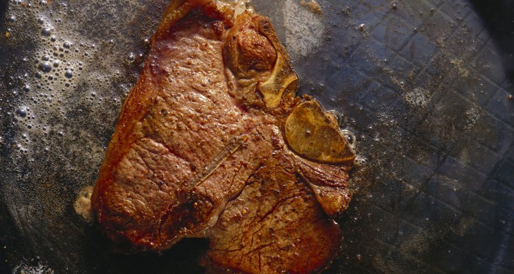 Porterhouse Steak frying in Butter