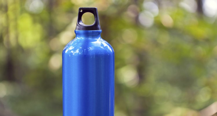 Water bottle in green forest