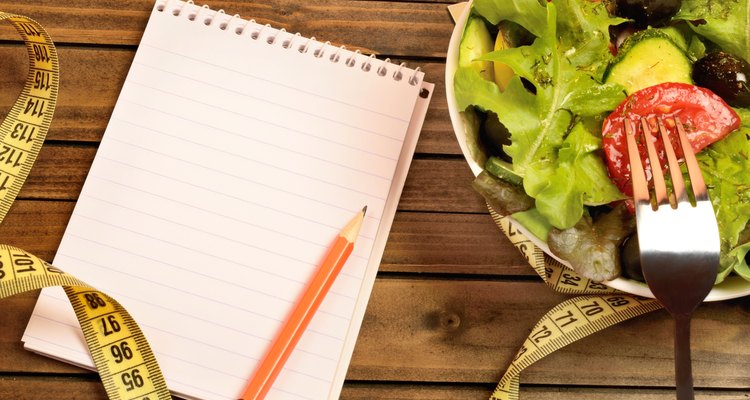 Vegetable salad and notepad