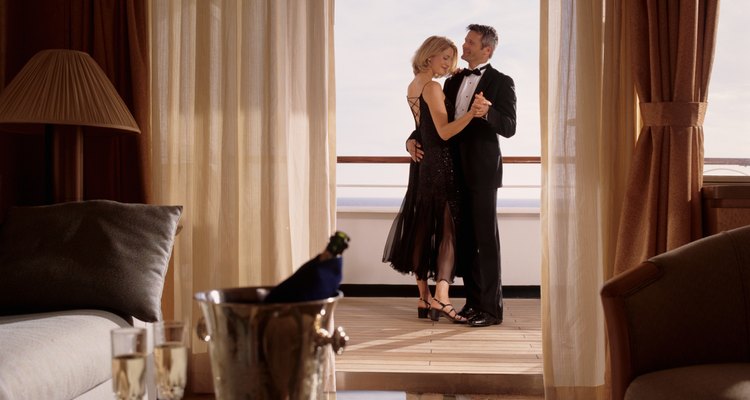 Elegant couple embracing in cruise ship cabin