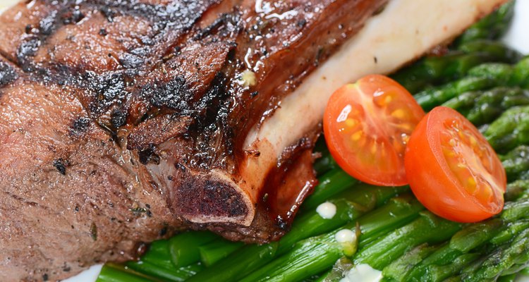 rack of lamb on grill with an asparagus