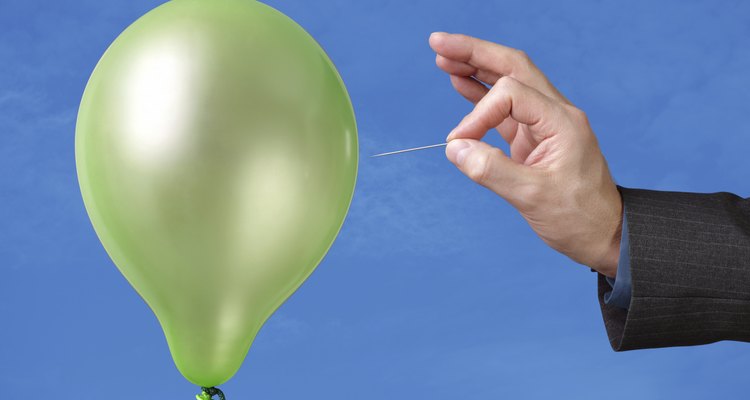 Once your mask is dry, use a needle to pop your balloon.