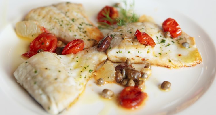 Fried fish fillet with capers and tomatoes
