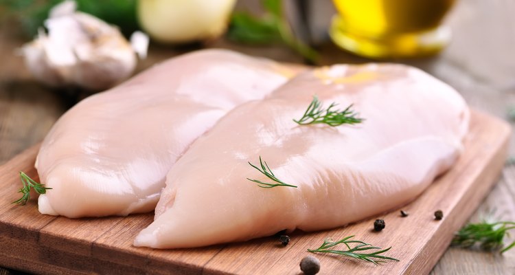Chicken breasts on cutting board