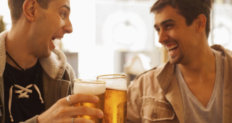 Young people drinking beer outdoors