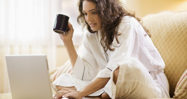 Woman working at home with laptop computer