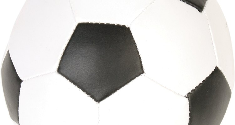 The outer covering of this football is comprised of many pentagons stitched together.