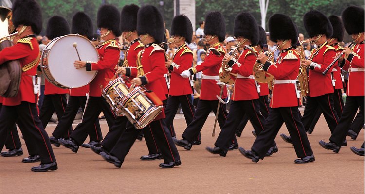 The sling holds the drum at a slight angle on one leg.