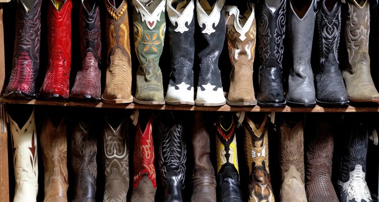 Rack of cowboy boots in shoe store, full frame