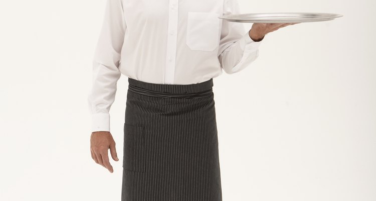 A Greek waiter's costume is inevitably black and white.