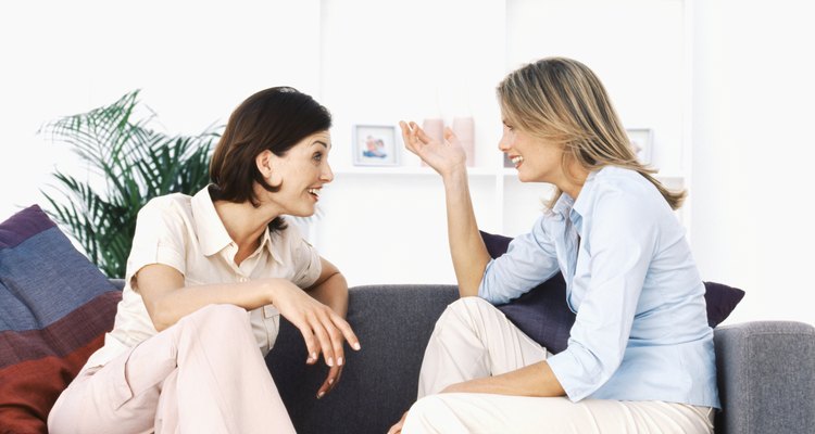 Two women talking in living room