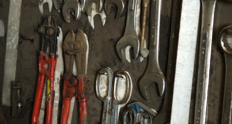 Dip metal such as tools in paint to protect from rust and corrosion.