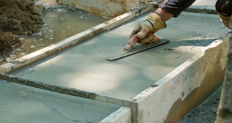 A finishing trowel gives a concrete slab a smooth surface.