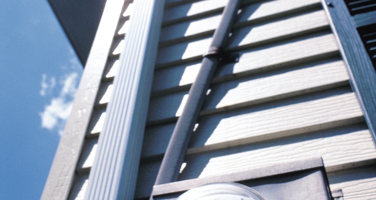 Electricians bend conduit so it can be installed around obstacles.