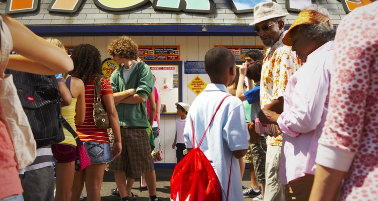 waiting in ticket line at amusement park