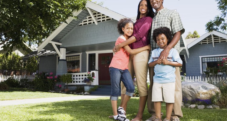 Embracing family in front of home