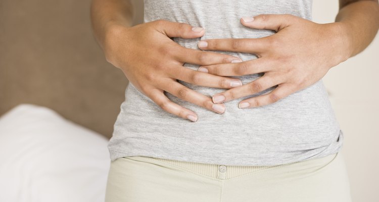 Woman holding stomach