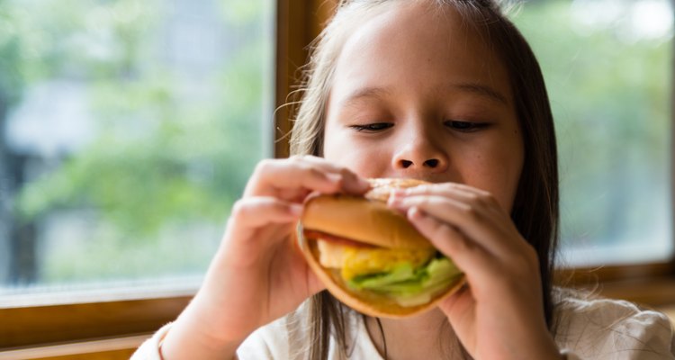 Girl eating hamburger