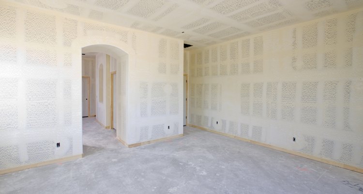 Plasterboard will levle out an uneven ceiling.
