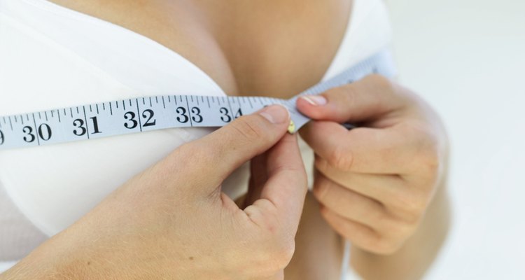 close-up of a woman measuring her bust