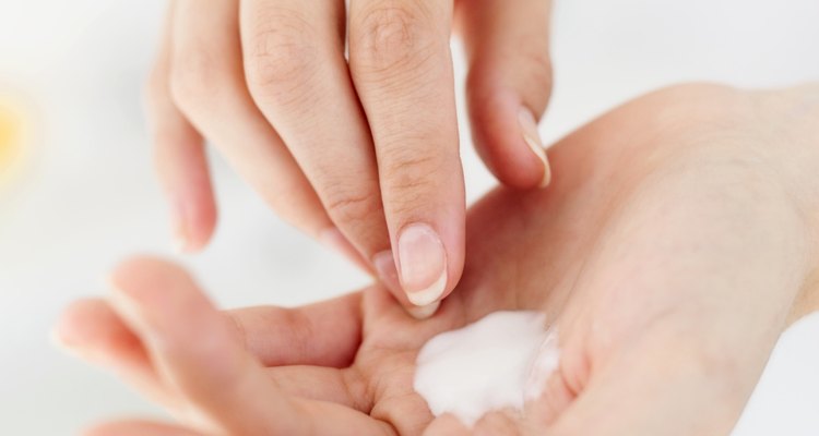 close-up of cream on a person's hand