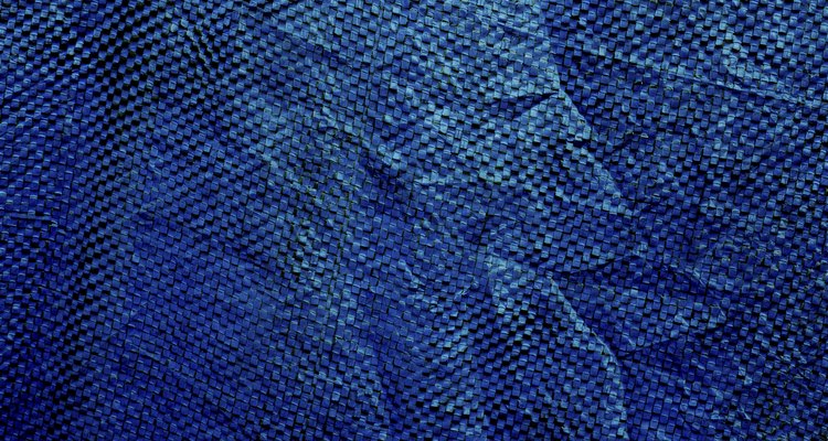 The plastic canvas has holes between the weave.