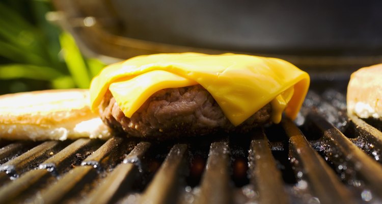 Barbecue scene, cheeseburger on the grill.